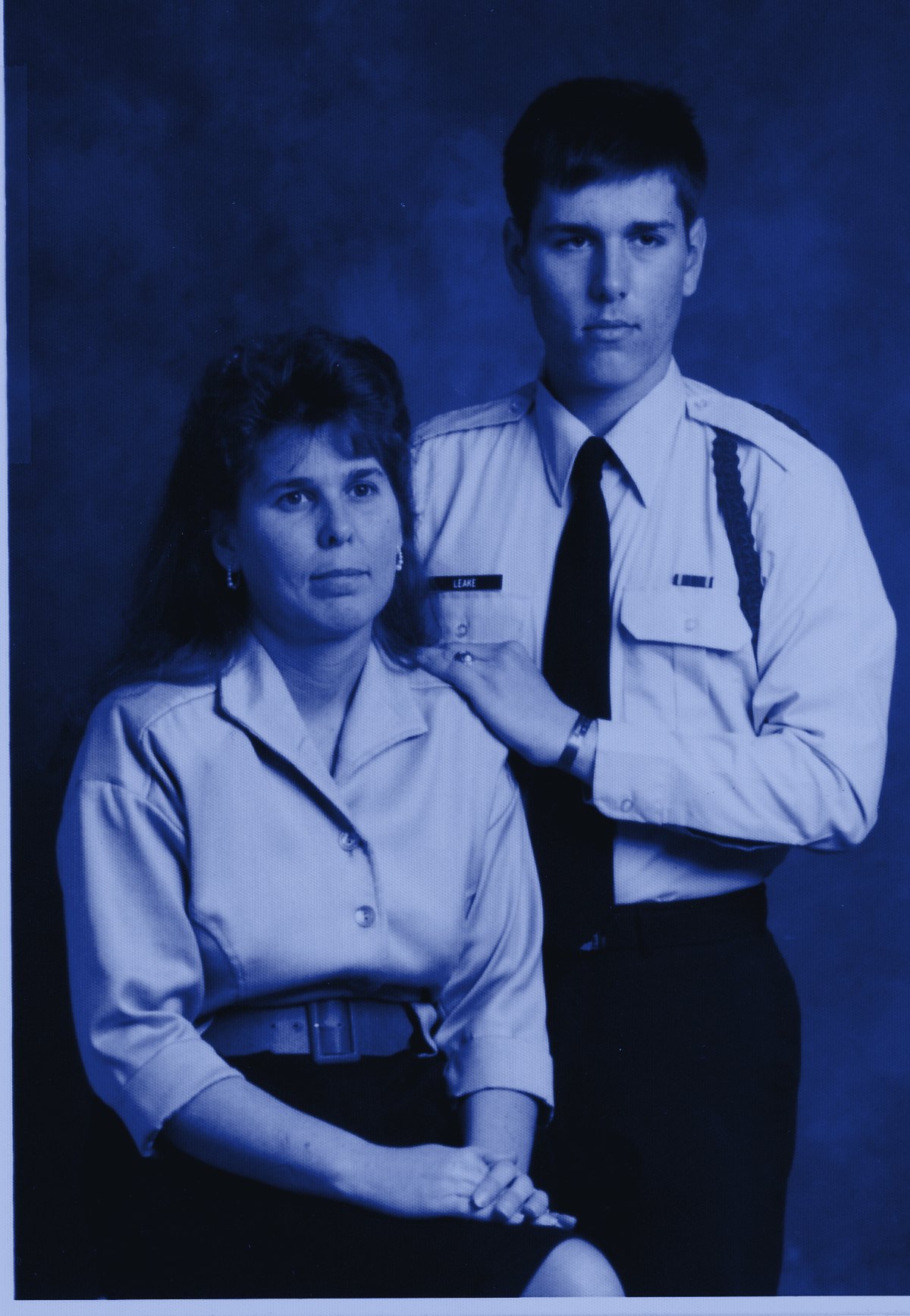 Travis Leake in his U.S. Air Force uniform, his hand on his mother's shoulder